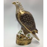 A Royal Crown Derby paperweight, 'North American Eagle', with printed marks to base and gold