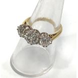 An 18ct yellow gold three stone diamond ring, the centre victorian cut diamond estimated 1.30cts,