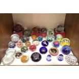 Thirty two various glass paperweights including Caithness 'Heart of Gold', Golden Jubilee Tribute