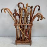 An aesthetic 'style' bamboo walking stick stand, with six divisions and metal drip tray, together