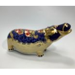 A Royal Crown Derby paperweight, 'Hippopotamus', with printed marks to base and gold stopper,