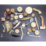 A quantity of Victorian ivory and bone sewing implements including two disc pin cushions, a pin