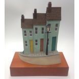 Paul Horton (contemporary) 'Homes and Hearts II', painted resin sculpture of three houses with a