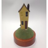 Paul Horton (contemporary) 'No Place Like Home', painted resin figure of a yellow house on a hill,