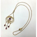 A yellow gold, amethyst and seed pearl necklace with three graduated circles, central amethyst above