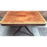 A Regency rectangular flame mahogany supper table with cross banding and inlaid brass stringing to