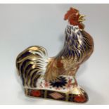 A Royal Crown Derby paperweight, 'Imari Rooster', with printed marks to base and gold stopper,