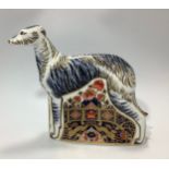 A Royal Crown Derby paperweight, 'Lurcher', with printed marks to base and gold stopper, limited