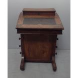 A Victorian walnut Davenport with inlaid scrollwork to the top letter compartment and desk top, 5