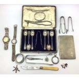 A small collection of assorted silver items comprising a pair of sugar tongs by William Woodman,