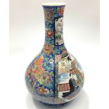 An early 20th century Japanese porcelain vase of onion form, decorated in polychrome enamels with