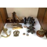 A small collection of maritime brassware and collectables including capstan bookends, anchor