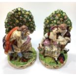 A pair of early 19th century Derby porcelain 'bocage' figure groups, each modelled with courting