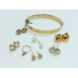 Six pairs of various 9ct gold earrings, including pearl studs and Celtic knot, weighing a total of