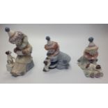 Three Lladro porcelain Clown / Pierrot figures including 'Pierrot with Puppy' No. 5277, 'Pierrot