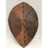 A late 19th / early 20th century Maasai shield, Kenya hide with painted geometric decoration in