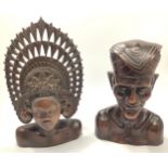 Two African carved hardwood busts, one of a man, the other of a woman in traditional headdress,