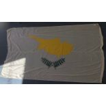 A very large ships Cypriot flag marked Nat. Cyprus 8 Bds Patt 571-4646, with metal clips, approx.