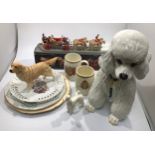 A large Italian pottery poodle together with a Beswick poodle, a Beswick Golden Retriever, a