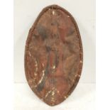An early 20th century Maasai child's shield, Kenya hide painted in earth red, black and white