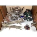 A pair of white-metal table pheasants, silver-plated teapot, other plate, Rotary Club car badge, and