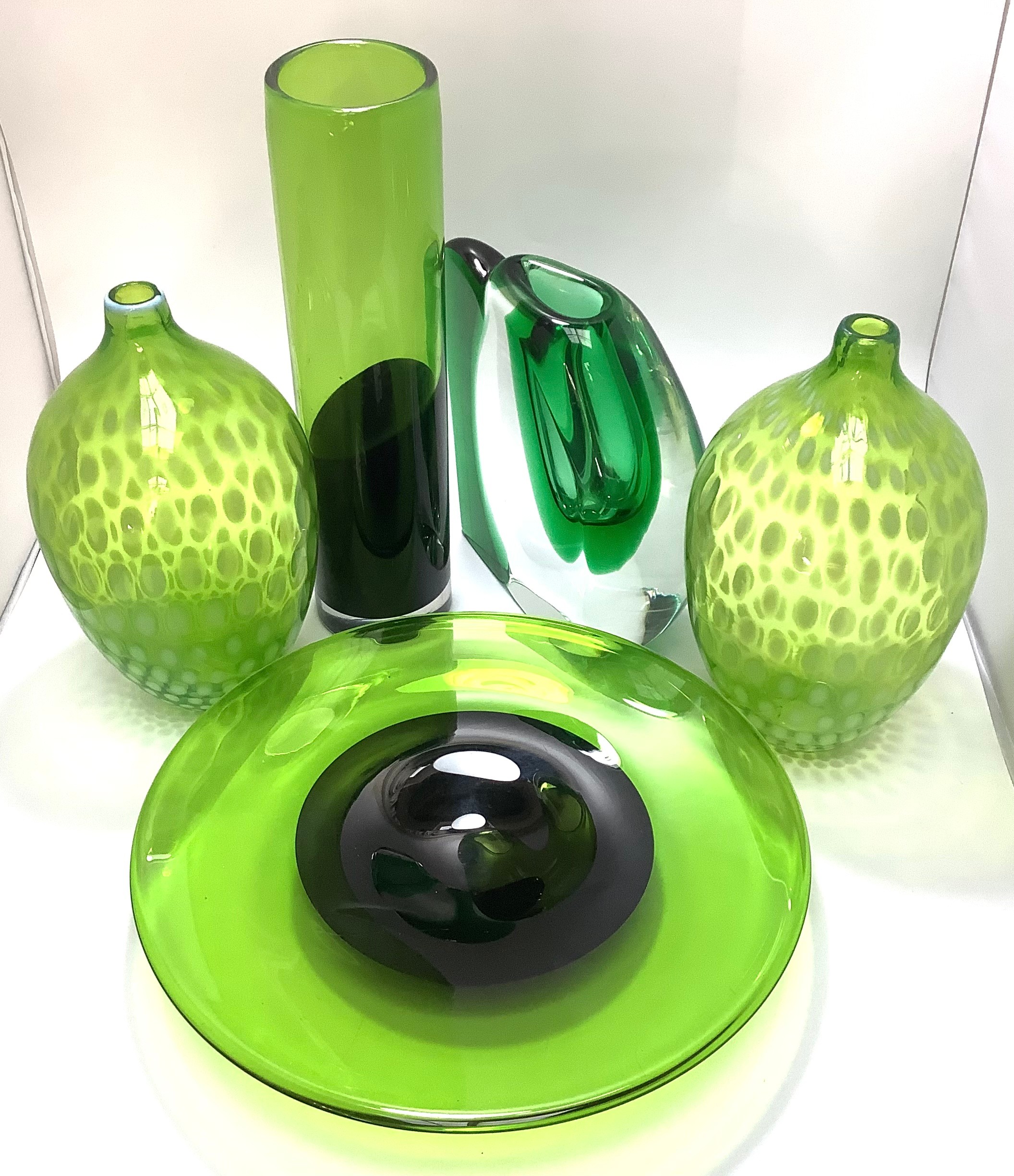 A heavy green glass vase signed 'Patr 98' to base, together with a pair of green and white opaque