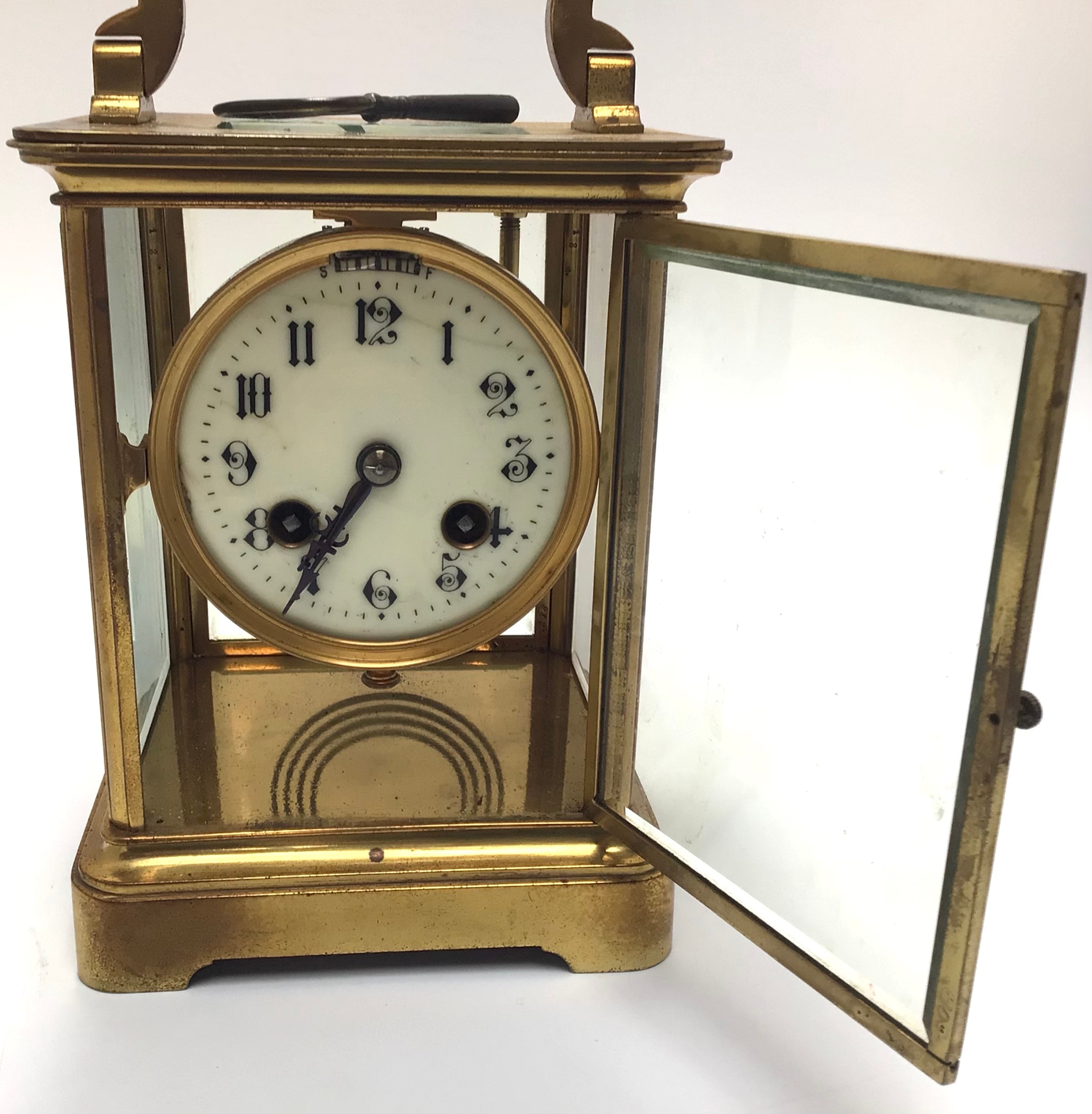A large brass cased eight day carriage clock with black arabic numerals to circular cream enamel - Image 2 of 3