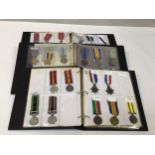 A good collection of approximately 90 assorted re-issue medals across three binders including The