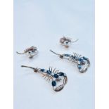 A pair of yellow metal scorpion brooches, set with blue and white stones, together with a pair of