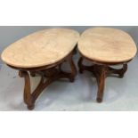 A pair of heavy oval salmon pink marble topped coffee tables, (From 'The Queen's Hotel, Southsea),