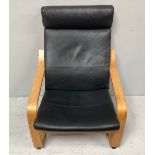 A Scandinavian inspired cantilever armchair, with typical bentwood frame and black leather
