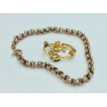 A 9ct gold belcher bracelet, weighing 6.9 grams, together with a 9ct gold stylised brooch set with