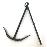 A black painted marine anchor, 94cm high