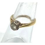 An 18ct gold and diamond solitaire ring, the centrally set round brilliant cut diamond weighing