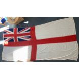 A very large white Naval ensign flag with union jack, marked '10 COTH ENSIGN 571 4001', with metal