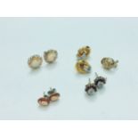 Four pairs of various 9ct gold earrings, together with a single 9ct gold round earring, weighing a