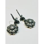 A pair of Victorian gold on silver drop earrings, set with daisy cluster drops with white paste