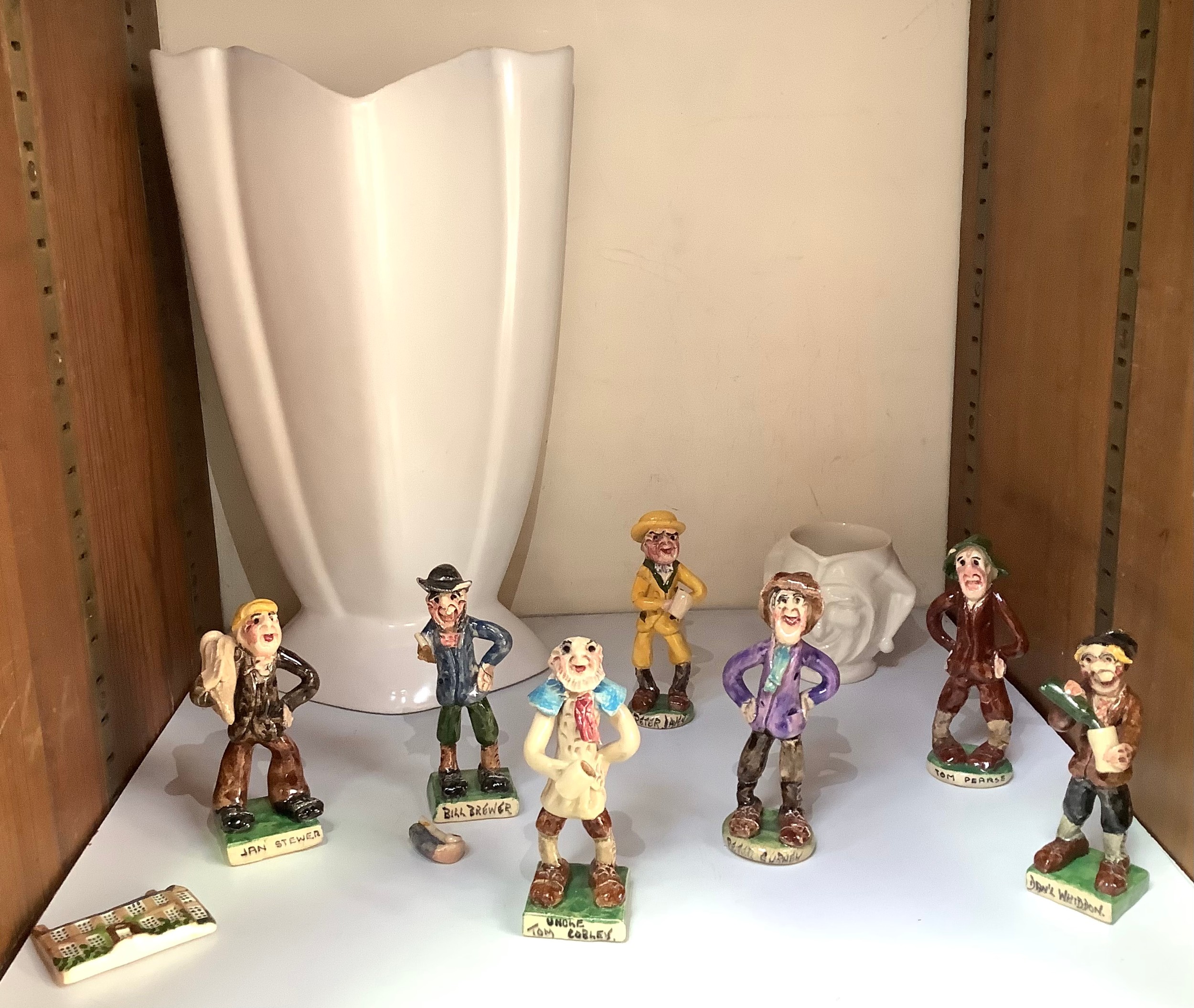 A collection of seven various Widdicombe pottery figures including Peter Daley, Bill Brewer and