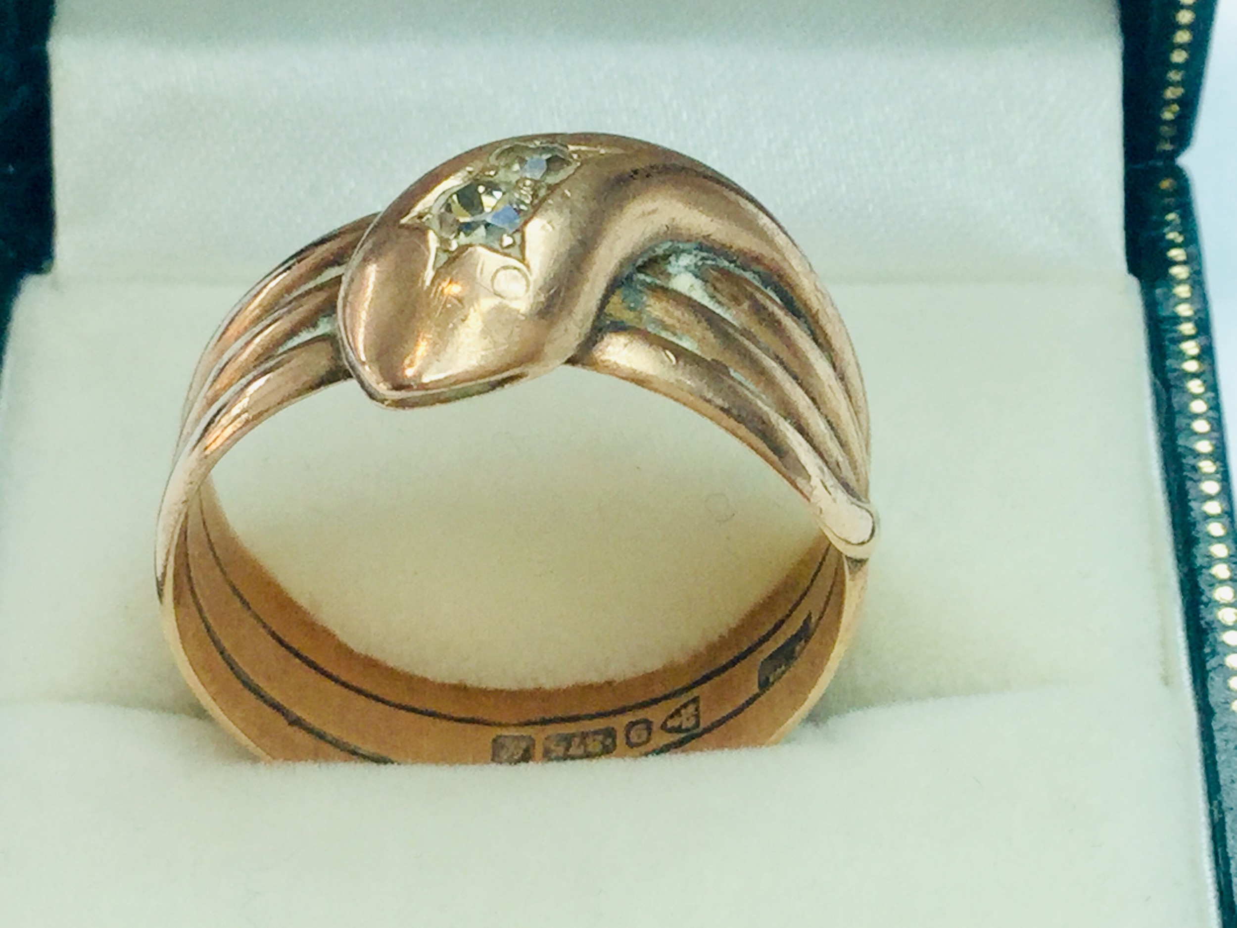 A gents 9ct gold dress ring shaped as a snake with rose cut diamonds for eyes, finger size W,
