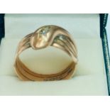 A gents 9ct gold dress ring shaped as a snake with rose cut diamonds for eyes, finger size W,