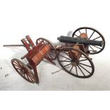A good quality hand made model replica of a Napoleonic era field cannon on gun carriage with