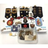 A quantity of military epaulettes, patches, buttons and cap badges, together with some coins and