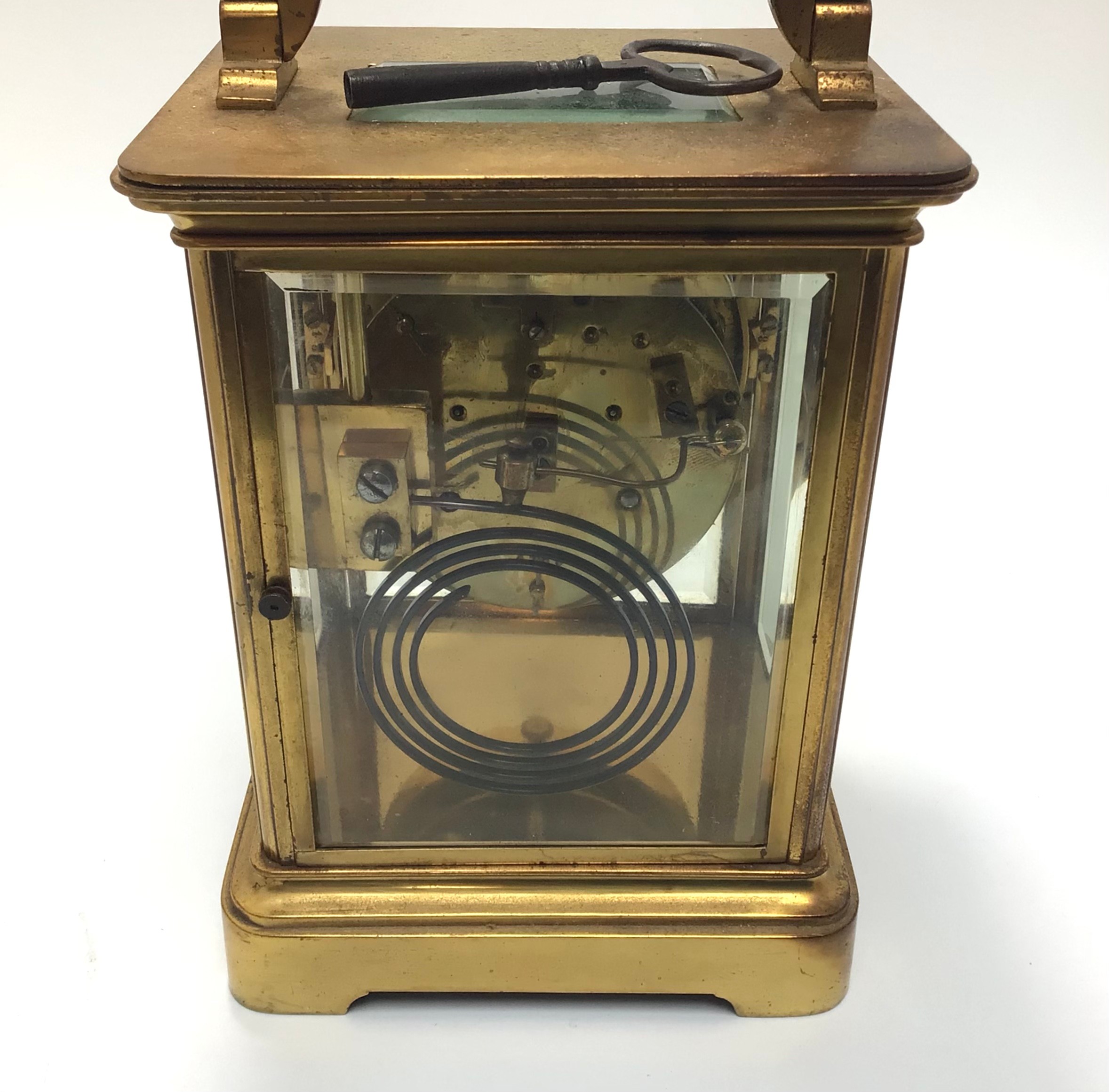 A large brass cased eight day carriage clock with black arabic numerals to circular cream enamel - Image 3 of 3