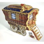 A Royal Crown Derby paperweight 'The Ledge Wagon' caravan, limited edition 67/1250, with printed