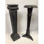 A black painted composite jardiniere stand with scrolled top, square tapering support with floral