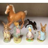 Four Beatrix Potter figures including 'Mrs Flopsy Bunny', 'Jemima Puddleduck', 'Foxy Whiskered