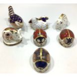 Seven small Royal Crown Derby paperweights including three ladybirds, a bird, a small pig in ther