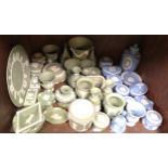 A large collection of Wedgwood blue and white and green and white Jasperware including vases,