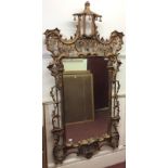 A 19th century Italian gilt gesso mirror in the Chinese Chippendale style, surmounted with a