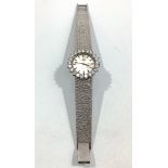 A ladies 18ct white gold Omega Geneve wristwatch, the silvered dial with batons denoting hours and